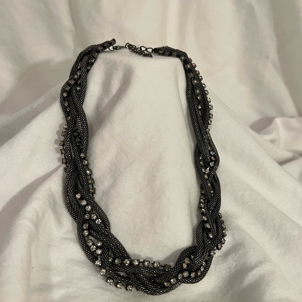 Braided metallic necklace with crystals.